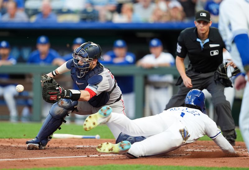 Aug 7, 2024; Kansas City, Missouri, USA; Kansas City Royals left fielder MJ Melendez (1) scores a run against Boston Red Sox catcher Danny Jansen (28) during the second inning at Kauffman Stadium. Mandatory Credit: Jay Biggerstaff-USA TODAY Sports