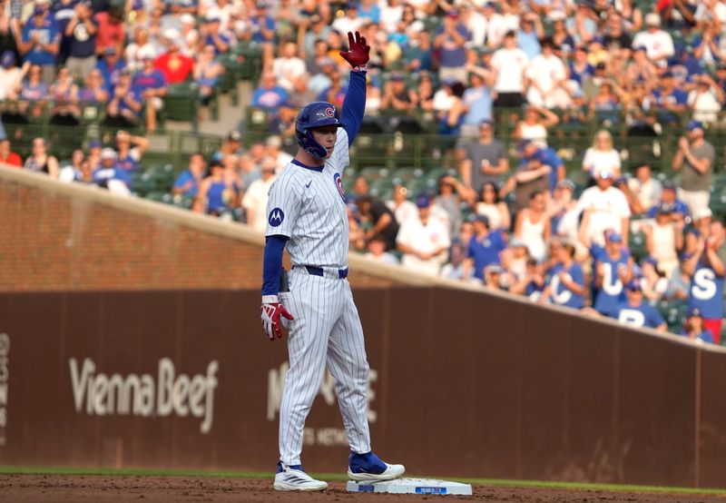 Aug 4, 2024; Chicago, Illinois, USA; Chicago Cubs outfielder Pete Crow-Armstrong (52) gestures after hitting a double against the St. Louis Cardinals during the second inning at Wrigley Field. Mandatory Credit: David Banks-USA TODAY Sports