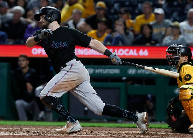 Sep 29, 2023; Pittsburgh, Pennsylvania, USA;  Miami Marlins shortstop Garrett Hampson (1) hits a single against the Pittsburgh Pirates during the eighth inning at PNC Park. Mandatory Credit: Charles LeClaire-USA TODAY Sports