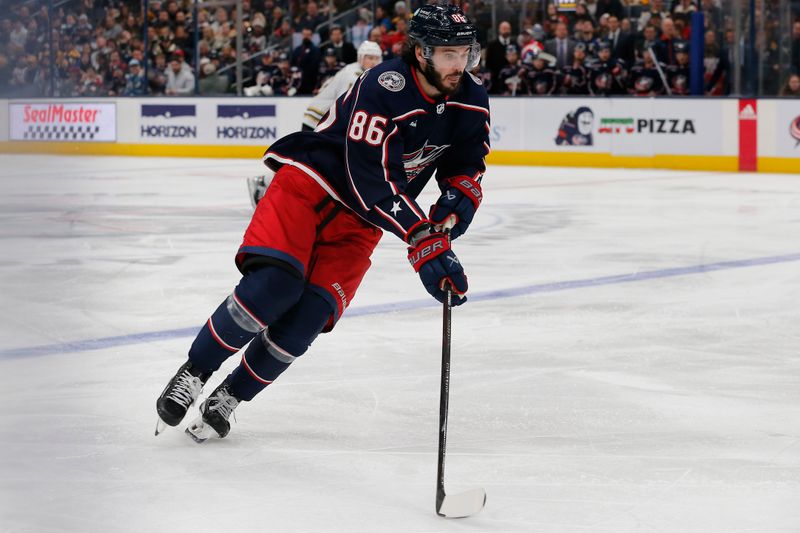 Jan 2, 2024; Columbus, Ohio, USA; Columbus Blue Jackets right wing Kirill Marchenko (86) carries the puck against the Boston Bruins during the third period at Nationwide Arena. Mandatory Credit: Russell LaBounty-USA TODAY Sports