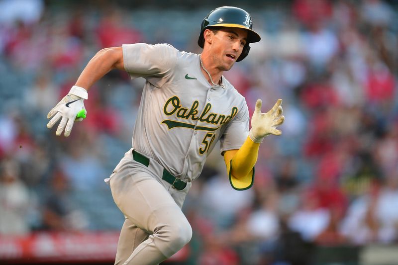 Jun 25, 2024; Anaheim, California, USA; Oakland Athletics third baseman Armando Alvarez (50) runs after hitting a double against the Los Angeles Angels during the third inning  at Angel Stadium. Mandatory Credit: Gary A. Vasquez-USA TODAY Sports