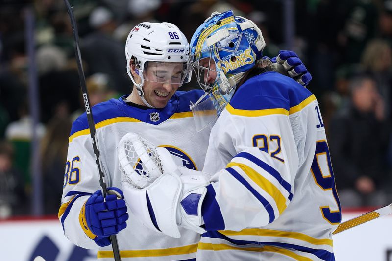 Nov 29, 2025; Saint Paul, Minnesota, USA; Buffalo Sabres center Noah Ostlund (86) and goaltender Colten Ellis (92) celebrate their shootout win against the Minnesota Wild at Grand Casino Arena. Mandatory Credit: Matt Krohn-Imagn Images