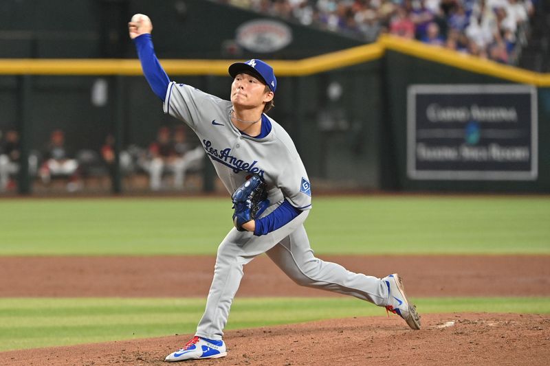 May 8, 2025; Phoenix, Arizona, USA; Los Angeles Dodgers pitcher Yoshinobu Yamamoto (18) throws in the third inning against the Arizona Diamondbacks at Chase Field. Mandatory Credit: Matt Kartozian-Imagn Images