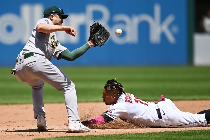 Jun 22, 2023; Cleveland, Ohio, USA; Cleveland Guardians third baseman Jose Ramirez (11) is caught stealing by Oakland Athletics shortstop Aledmys Diaz (12) during the fourth inning at Progressive Field. Mandatory Credit: Ken Blaze-USA TODAY Sports