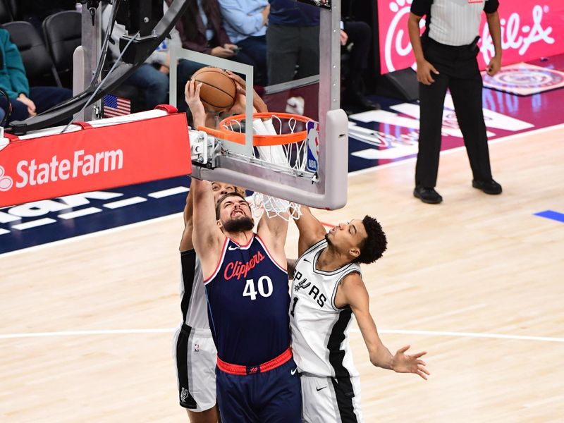 INGLEWOOD, CA - NOVEMBER 4: Ivica Zubac #40 of the LA Clippers drives to the basket during the game against the San Antonio Spurs on November 4, 2024 at Intuit Dome in Los Angeles, California. NOTE TO USER: User expressly acknowledges and agrees that, by downloading and/or using this Photograph, user is consenting to the terms and conditions of the Getty Images License Agreement. Mandatory Copyright Notice: Copyright 2024 NBAE (Photo by Adam Pantozzi/NBAE via Getty Images)