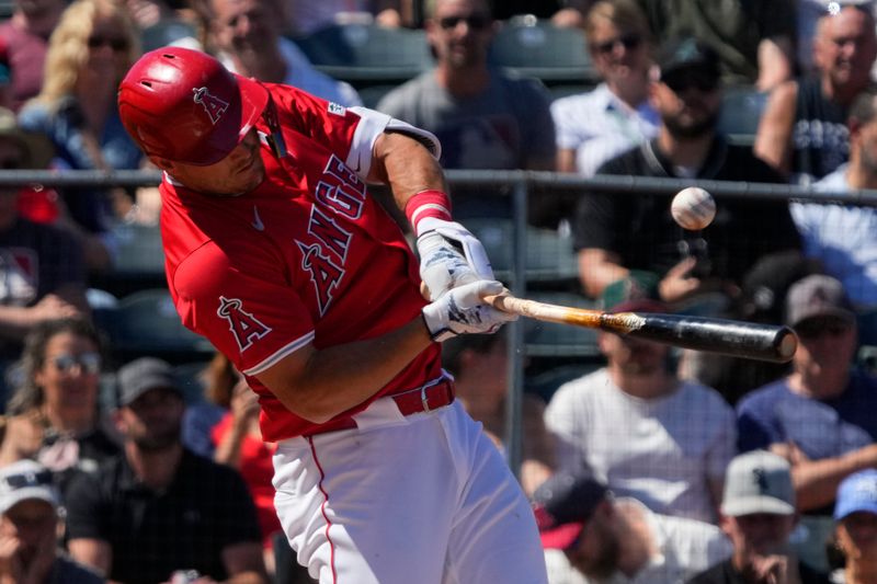 Mar 22, 2024; Tempe, Arizona, USA; Los Angeles Angels center fielder Mike Trout (27) hits against the Chicago White Sox in the third inning at Tempe Diablo Stadium. Mandatory Credit: Rick Scuteri-USA TODAY Sports