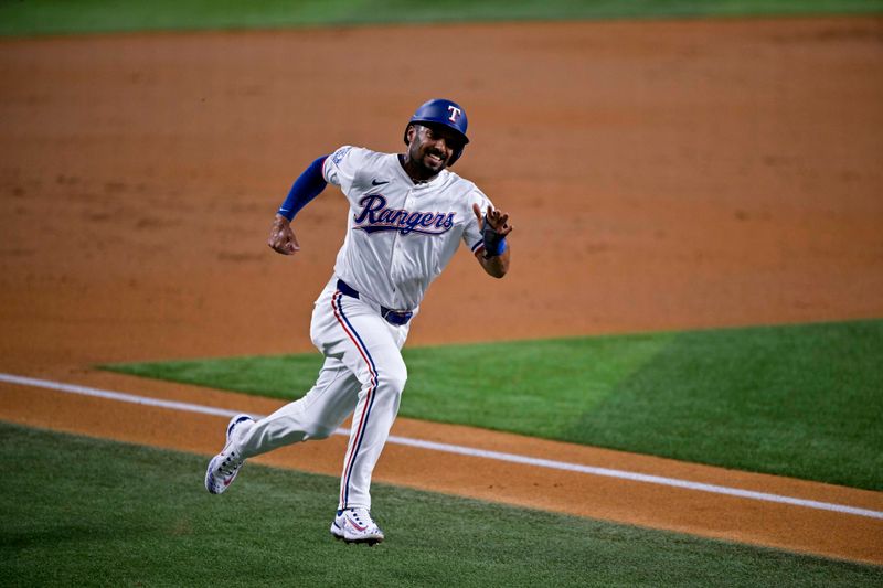 Aug 15, 2024; Arlington, Texas, USA; Texas Rangers second baseman Marcus Semien (2) scores against the Minnesota Twins during the first inning at Globe Life Field. Mandatory Credit: Jerome Miron-USA TODAY Sports