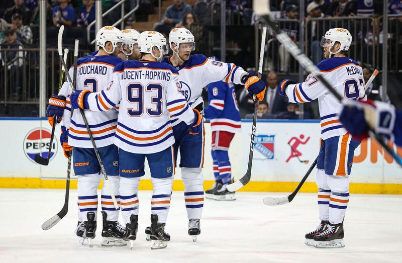 Mar 16, 2025; New York, New York, USA; Edmonton Oilers right wing Corey Perry (90) celebrates his goal with defenseman Evan Bouchard (2), center Ryan Nugent, Hopkins (93) and center Connor McDavid (97) during the first period against the New York Rangers at Madison Square Garden. Mandatory Credit: Danny Wild-Imagn Images