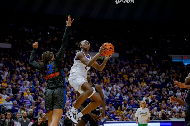 Feb 4, 2024; Baton Rouge, Louisiana, USA; LSU Lady Tigers guard Flau'jae Johnson (4) shoots against Florida Gators guard Laila Reynolds (13) during the second half at Pete Maravich Assembly Center. Mandatory Credit: Matthew Hinton-USA TODAY Sports