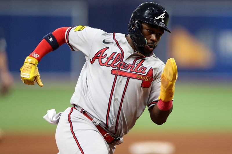 Jul 8, 2023; St. Petersburg, Florida, USA;  Atlanta Braves center fielder Michael Harris II (23) rounds third base to score a run against the Tampa Bay Rays in the ninth inning at Tropicana Field. Mandatory Credit: Nathan Ray Seebeck-USA TODAY Sports