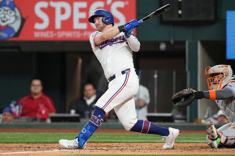 Jun 17, 2024; Arlington, Texas, USA; Texas Rangers designated hitter Robbie Grossman (4) follows through on a two-run home run against the New York Mets during the third inning at Globe Life Field. Mandatory Credit: Jim Cowsert-USA TODAY Sports