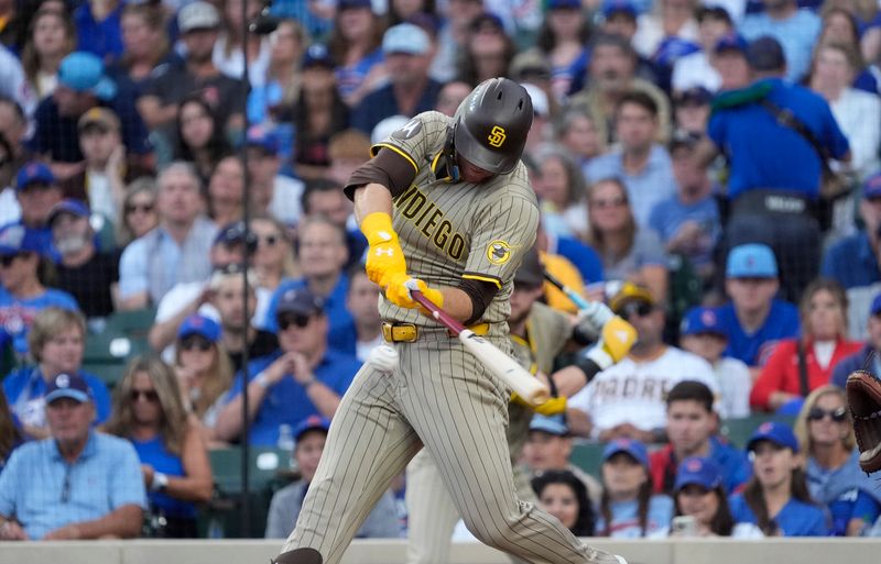 Oct 2, 2025; Chicago, Illinois, USA; San Diego Padres left fielder Gavin Sheets (30) singles during the fifth inning against the Chicago Cubs during game three of the Wildcard round for the 2025 MLB playoffs at Wrigley Field. Mandatory Credit: David Banks-Imagn Images