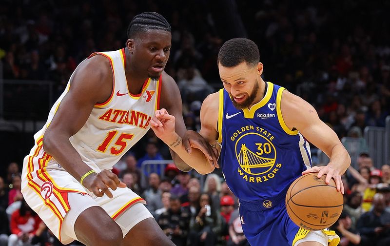 ATLANTA, GEORGIA - FEBRUARY 03:  Stephen Curry #30 of the Golden State Warriors drives against Clint Capela #15 of the Atlanta Hawks during the fourth quarter at State Farm Arena on February 03, 2024 in Atlanta, Georgia.  NOTE TO USER: User expressly acknowledges and agrees that, by downloading and/or using this photograph, user is consenting to the terms and conditions of the Getty Images License Agreement.  (Photo by Kevin C. Cox/Getty Images)