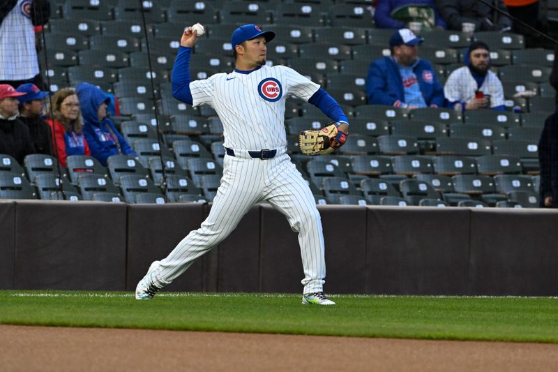 Apr 2, 2024; Chicago, Illinois, USA; Chicago Cubs right fielder Seiya Suzuki (27) warms up before the teams game against the Colorado Rockies at Wrigley Field. Mandatory Credit: Matt Marton-USA TODAY Sports