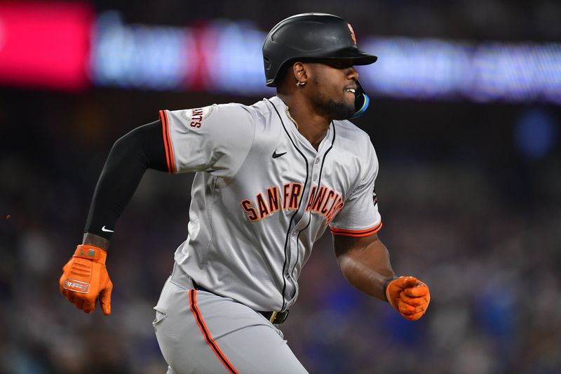 Apr 3, 2024; Los Angeles, California, USA; San Francisco Giants designated hitter Jorge Soler (2) runs after hitting a double against the Los Angeles Dodgers during the sixth inning at Dodger Stadium. Mandatory Credit: Gary A. Vasquez-USA TODAY Sports