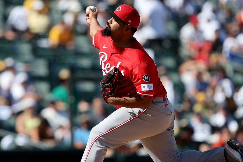 Sep 14, 2025; West Sacramento, California, USA; Cincinnati Reds pitcher Tony Santillan (64) throws a pitch against the Athletics during the sixth inning at Sutter Health Park. Mandatory Credit: Dennis Lee-Imagn Images