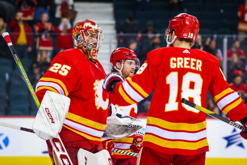 Jan 9, 2024; Calgary, Alberta, CAN; Calgary Flames goaltender Jacob Markstrom (25) celebrates with teammates win over Ottawa Senators at Scotiabank Saddledome. Mandatory Credit: Sergei Belski-USA TODAY Sports