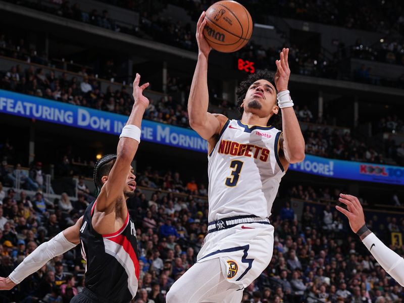 DENVER, CO - FEBRUARY 10: Julian Strawther #3 of the Denver Nuggets drives to the basket during the game against the Portland Trail Blazers on February 10, 2025 at Ball Arena in Denver, Colorado. NOTE TO USER: User expressly acknowledges and agrees that, by downloading and/or using this Photograph, user is consenting to the terms and conditions of the Getty Images License Agreement. Mandatory Copyright Notice: Copyright 2025 NBAE (Photo by Garrett Ellwood/NBAE via Getty Images)