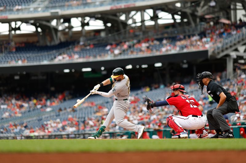 Aug 13, 2023; Washington, District of Columbia, USA; Oakland Athletics first baseman Seth Brown (15) hits a two run home run against the Washington Nationals during the first inning at Nationals Park. Mandatory Credit: Geoff Burke-USA TODAY Sports