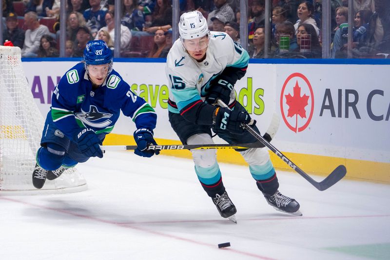 Sep 24, 2024; Vancouver, British Columbia, CAN; Vancouver Canucks forward Danton Heinen (20) stick checks Seattle Kraken forward Brandon Biro (15) during the third period at Rogers Arena. Mandatory Credit: Bob Frid-Imagn Images