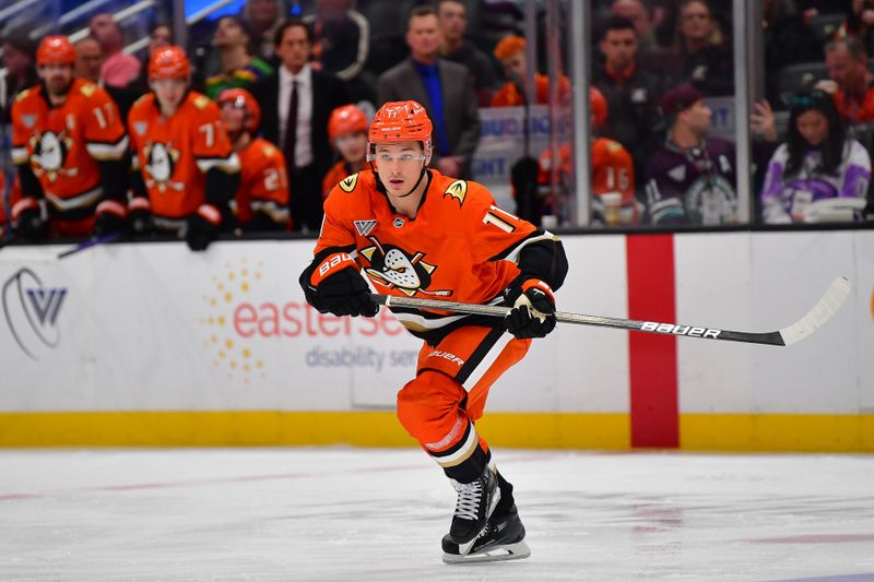 Jan 23, 2025; Anaheim, California, USA; Anaheim Ducks center Trevor Zegras (11) in action against the Pittsburgh Penguins during the third period at Honda Center. Mandatory Credit: Gary A. Vasquez-Imagn Images