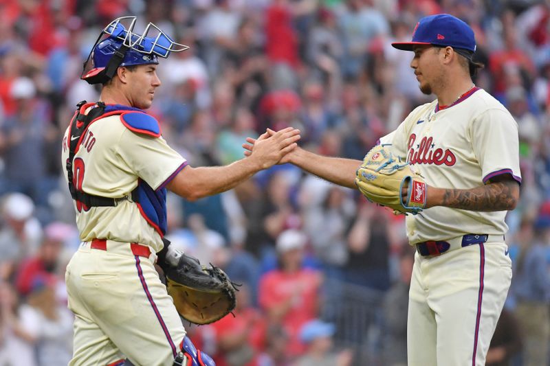 May 6, 2024; Philadelphia, Pennsylvania, USA; Philadelphia Phillies catcher J.T. Realmuto (10) and pitcher Orion Kerkering (50) celebrate win against the San Francisco Giants at Citizens Bank Park. Mandatory Credit: Eric Hartline-USA TODAY Sports