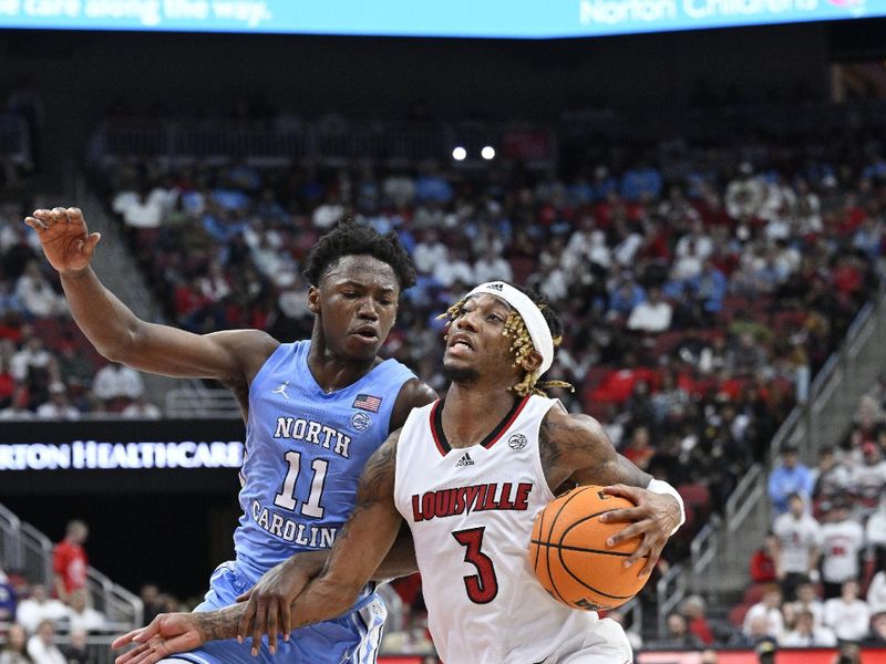 Jan 14, 2023; Louisville, Kentucky, USA;  Louisville Cardinals guard El Ellis (3) drives to the basket against North Carolina Tar Heels guard D'Marco Dunn (11) during the second half at KFC Yum! Center. North Carolina defeated Louisville 80-59. Mandatory Credit: Jamie Rhodes-USA TODAY Sports