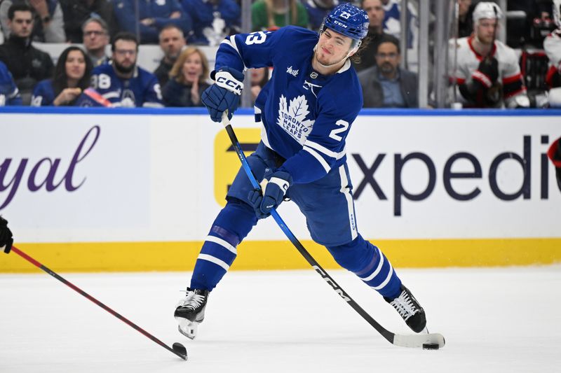 Apr 22, 2025; Toronto, Ontario, CAN;  Toronto Maple Leafs forward Matthew Knies (23) shoots the puck against the Ottawa Senators in the first period in game two of the first round of the 2025 Stanley Cup Playoffs at Scotiabank Arena. Mandatory Credit: Dan Hamilton-Imagn Images