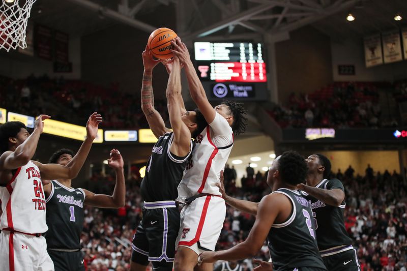 Jan 13, 2024; Lubbock, Texas, USA;  Kansas State Wildcats guard Dorian Minister (3) and Texas Tech Red Raiders guard Darrion Williams (5) go after a rebound in the second half at United Supermarkets Arena. Mandatory Credit: Michael C. Johnson-USA TODAY Sports