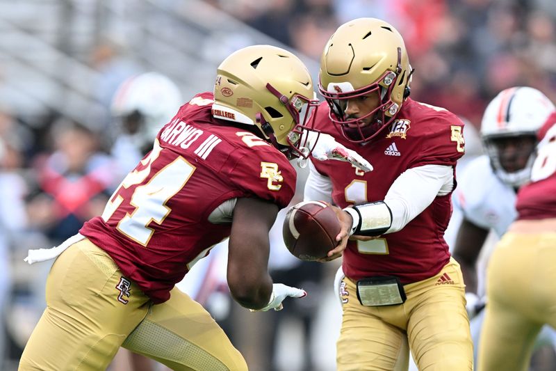 Sep 30, 2023; Chestnut Hill, Massachusetts, USA; Boston College Eagles quarterback Thomas Castellanos (1) hands the ball off to running back Pat Garwo III (24) during the first half at Alumni Stadium. Mandatory Credit: Brian Fluharty-USA TODAY Sports