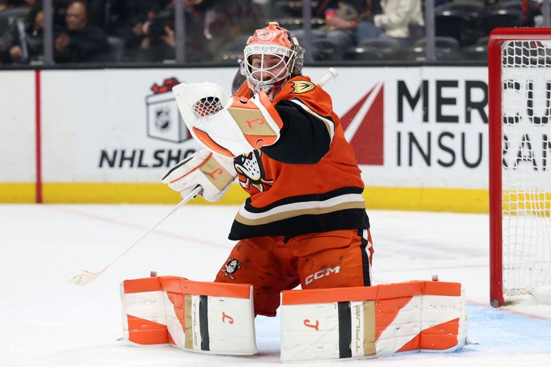 Dec 20, 2025; Anaheim, California, USA;  Anaheim Ducks goaltender Lukas Dostal (1) makes a save during the third period against the Columbus Blue Jackets at Honda Center. Mandatory Credit: Kiyoshi Mio-Imagn Images