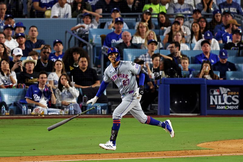 Oct 20, 2024; Los Angeles, California, USA; New York Mets third base Mark Vientos (27) his a two run home run during the fourth inning against the Los Angeles Dodgers during game six of the NLCS for the 2024 MLB playoffs at Dodger Stadium. Mandatory Credit: Jason Parkhurst-Imagn Images