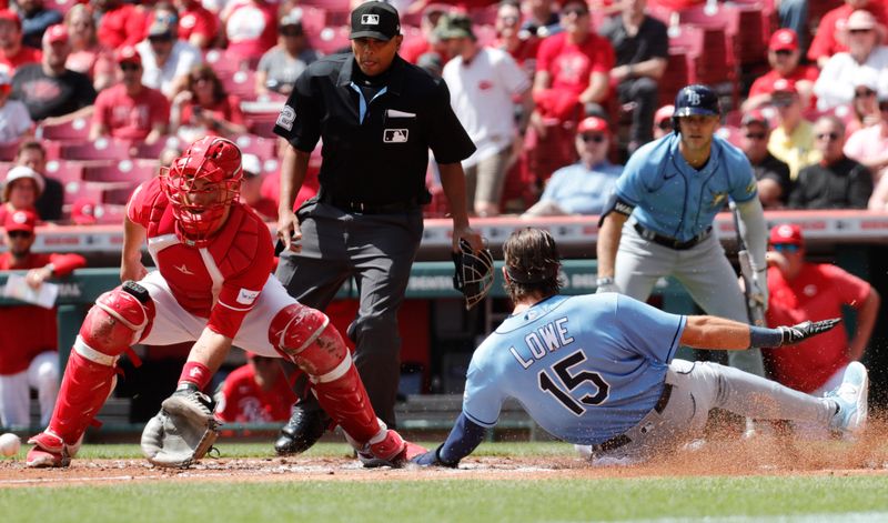 Apr 19, 2023; Cincinnati, Ohio, USA; Tampa Bay Rays right fielder Josh Lowe (15) scores a run past Cincinnati Reds catcher Luke Maile (22) during the first inning at Great American Ball Park. Mandatory Credit: David Kohl-USA TODAY Sports