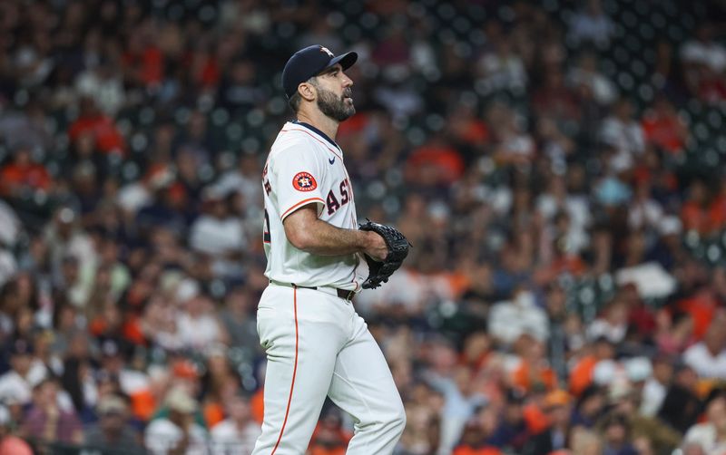 May 1, 2024; Houston, Texas, USA;  Houston Astros starting pitcher Justin Verlander (35) reacts after giving up a walk during the fourth inning against the Cleveland Guardians at Minute Maid Park. Mandatory Credit: Troy Taormina-USA TODAY Sports