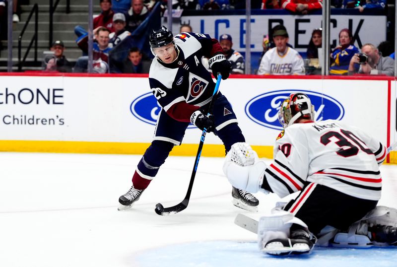 Feb 28, 2026; Denver, Colorado, USA; Colorado Avalanche center Nathan MacKinnon (29) shoots the puck in the second period against the Chicago Blackhawks at Ball Arena. Mandatory Credit: Ron Chenoy-Imagn Images