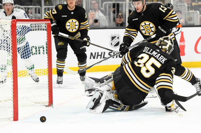 Feb 8, 2024; Boston, Massachusetts, USA; Boston Bruins goaltender Linus Ullmark (35) has the puck growing through his pads during the second period against the Vancouver Canucks at TD Garden. Mandatory Credit: Bob DeChiara-USA TODAY Sports