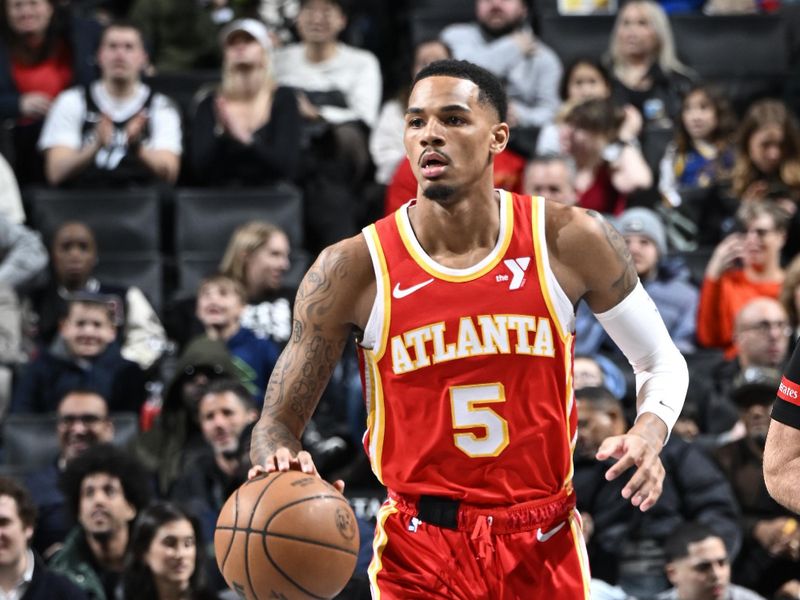 BROOKLYN, NY - FEBRUARY 29: Dejounte Murray #5 of the Atlanta Hawks dribbles the ball during the game against the Brooklyn Nets on February 29, 2024 at Barclays Center in Brooklyn, New York. NOTE TO USER: User expressly acknowledges and agrees that, by downloading and or using this Photograph, user is consenting to the terms and conditions of the Getty Images License Agreement. Mandatory Copyright Notice: Copyright 2024 NBAE (Photo by David Dow/NBAE via Getty Images)