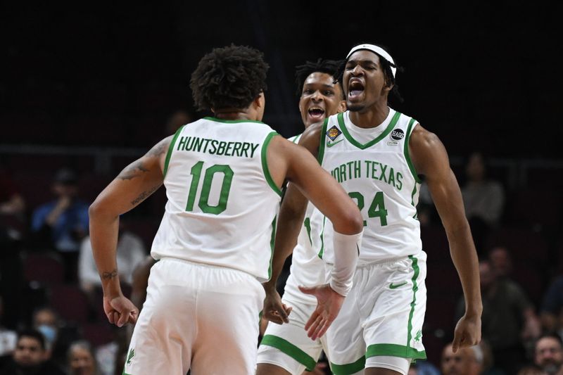 Mar 30, 2023; Las Vegas, NV, USA; North Texas Mean Green forward Jayden Martinez (24) and North Texas Mean Green guard Kai Huntsberry (10) celebrate a basket against the UAB Blazers in the first half at Orleans Arena. Mandatory Credit: Candice Ward-USA TODAY Sports