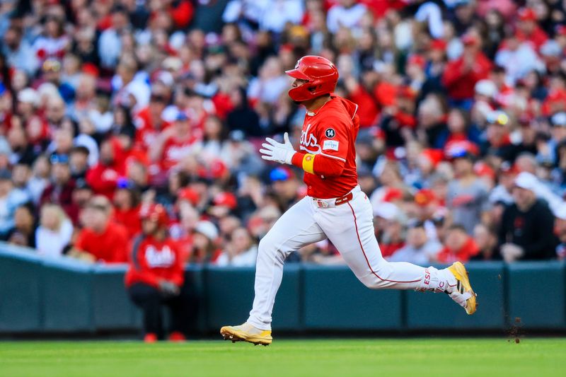 Apr 12, 2025; Cincinnati, Ohio, USA; Cincinnati Reds second baseman Santiago Espinal (4) runs to second after hitting a double in the third inning against the Pittsburgh Pirates at Great American Ball Park. Mandatory Credit: Katie Stratman-Imagn Images