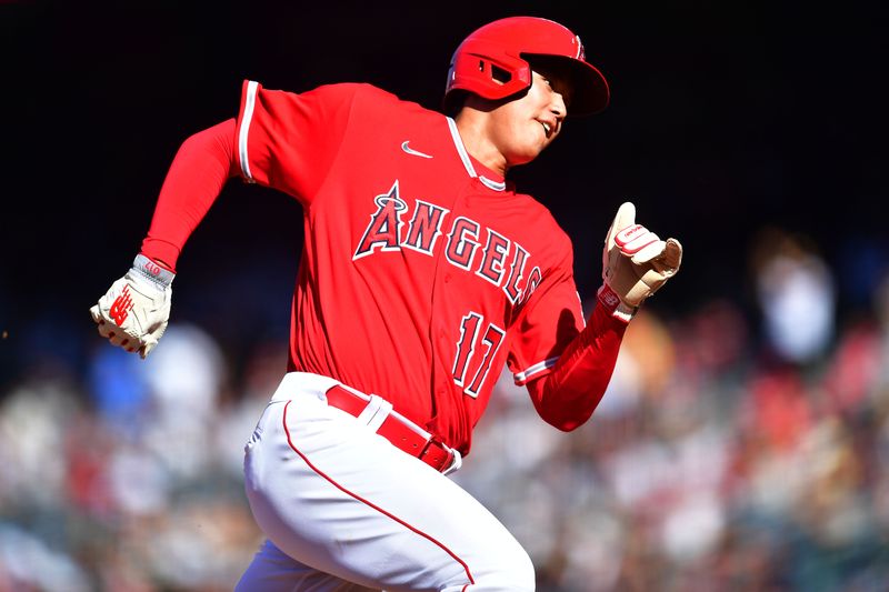 Jul 19, 2023; Anaheim, California, USA;  Los Angeles Angels designated hitter Shohei Ohtani (17) runs home to score against the New York Yankees during the third inning at Angel Stadium. Mandatory Credit: Gary A. Vasquez-USA TODAY Sports