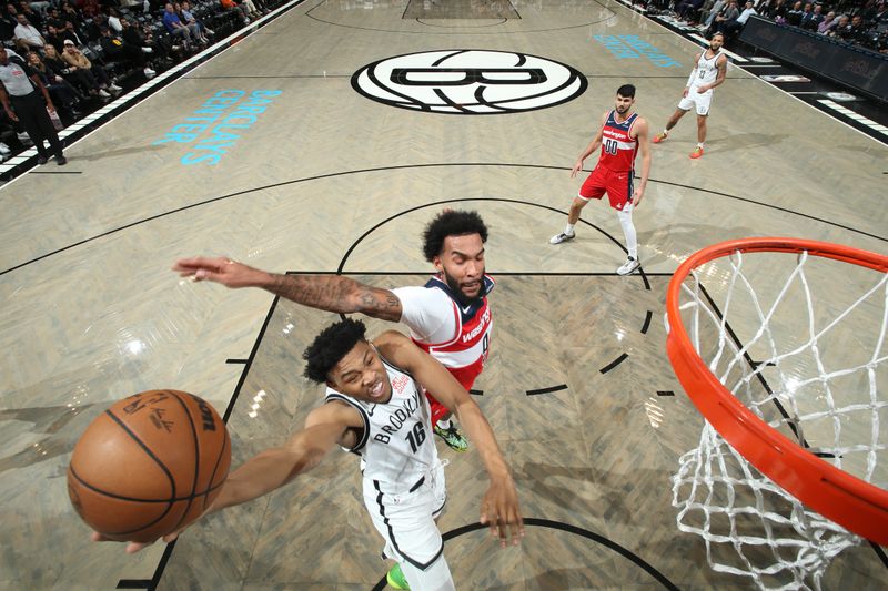 BROOKLYN, NY - OCTOBER 14: Jaylen Martin #16 of the Brooklyn Nets drives to the basket during the game against the Washington Wizards during a NBA preseason game on October 14, 2024 at Barclays Center in Brooklyn, New York. NOTE TO USER: User expressly acknowledges and agrees that, by downloading and or using this Photograph, user is consenting to the terms and conditions of the Getty Images License Agreement. Mandatory Copyright Notice: Copyright 2024 NBAE (Photo by Nathaniel S. Butler/NBAE via Getty Images)