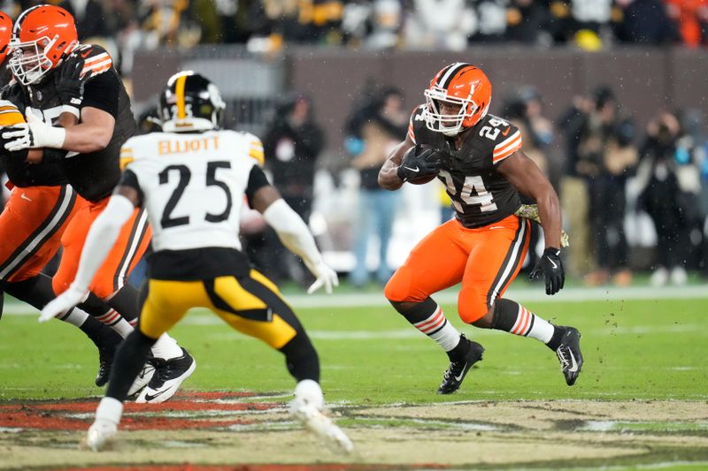 Cleveland Browns running back Nick Chubb (24) carries in the first half of an NFL football game against the Pittsburgh Steelers, Thursday, Nov. 21, 2024, in Cleveland. (AP Photo/Sue Ogrocki)