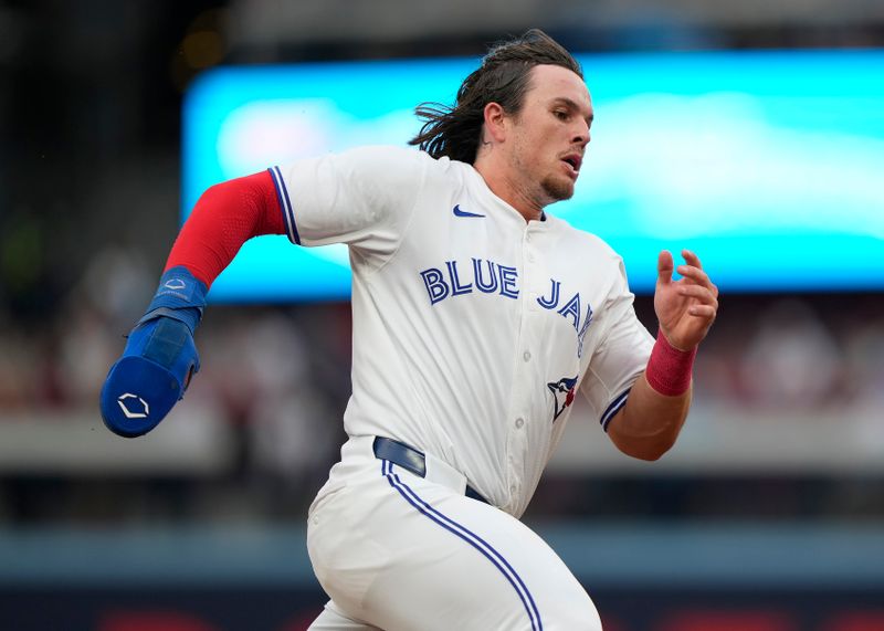 Jun 18, 2024; Toronto, Ontario, CAN; Toronto Blue Jays right fielder Addison Barger (47) rounds third base to score on a single by third baseman Ernie Clement (not pictured) against the Boston Red Sox during the second inning at Rogers Centre. Mandatory Credit: John E. Sokolowski-USA TODAY Sports