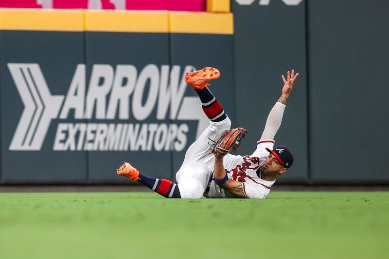 Sep 7, 2023; Atlanta, Georgia, USA; Atlanta Braves left fielder Eddie Rosario (8) makes a diving catch against the St. Louis Cardinals in the ninth inning at Truist Park. Mandatory Credit: Brett Davis-USA TODAY Sports
