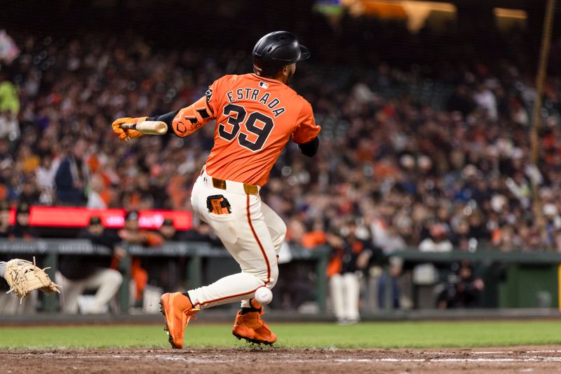 May 17, 2024; San Francisco, California, USA; San Francisco Giants second baseman Thairo Estrada (39) is hit by a foul ball during the fifth inning of the game against the Colorado Rockies at Oracle Park. Mandatory Credit: John Hefti-USA TODAY Sports