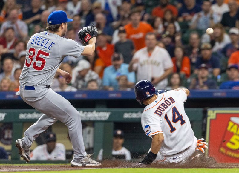 May 16, 2023; Houston, Texas, USA;  Houston Astros second baseman Mauricio Dubon (14) steals home on a wild pitch against Chicago Cubs starting pitcher Justin Steele (35) in the first inning at Minute Maid Park. Mandatory Credit: Thomas Shea-USA TODAY Sports