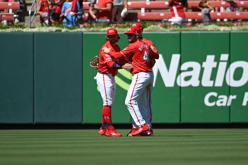 Jun 23, 2024; St. Louis, Missouri, USA; St. Louis Cardinals left fielder Brendan Donovan (33), right fielder Dylan Carlson (3) and right fielder Alec Burleson (41) celebrate a victory over the San Francisco Giants at Busch Stadium. Mandatory Credit: Joe Puetz-USA TODAY Sports