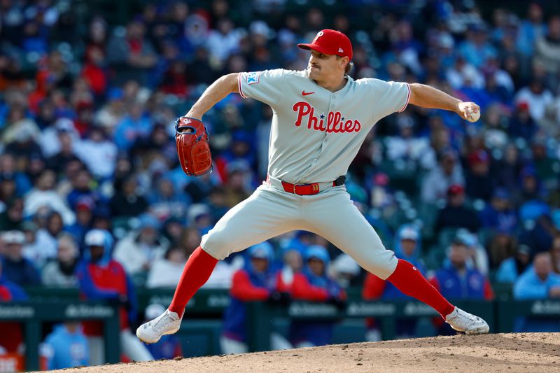 Apr 25, 2025; Chicago, Illinois, USA; Philadelphia Phillies relief pitcher Tanner Banks (58) delivers a pitch against the Chicago Cubs during the fourth inning at Wrigley Field. Mandatory Credit: Kamil Krzaczynski-Imagn Images
