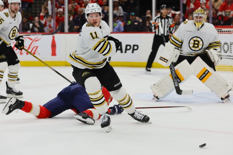 May 8, 2024; Sunrise, Florida, USA; Boston Bruins center Trent Frederic (11) defends against the Florida Panthers during the second period in game two of the second round of the 2024 Stanley Cup Playoffs at Amerant Bank Arena. Mandatory Credit: Sam Navarro-USA TODAY Sports
