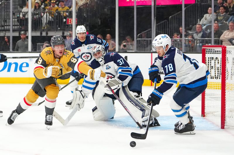 Apr 13, 2026; Las Vegas, Nevada, USA; Vegas Golden Knights center Jack Eichel (9) reaches for the puck as Winnipeg Jets defenseman Jacob Bryson (78) looks to clear it during the second period at T-Mobile Arena. Mandatory Credit: Stephen R. Sylvanie-Imagn Images Apr 13, 2026; Las Vegas, Nevada, USA; Vegas Golden Knights center Jack Eichel (9) reaches for the puck as Winnipeg Jets defenseman Jacob Bryson (78) looks to clear it during the second period at T-Mobile Arena. Mandatory Credit: Stephen R. Sylvanie-Imagn Images